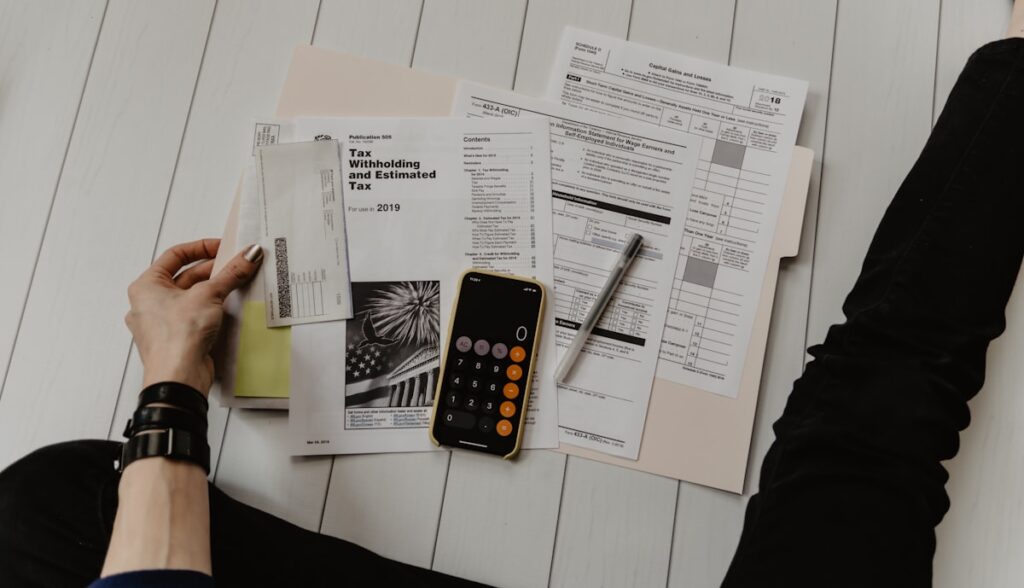 UAE e-invoicing on laptop with tax documents